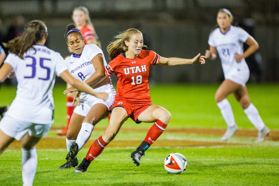 University+of+Utah+Redshirt+Sophomore+Midfielder+Natalie+Kump+%2818%29+dribbled+past+two+University+of+Washington+defenders+in+an+NCAA+Womens+Soccer+game+vs.+Washington+at+Ute+Soccer+Field+in+Salt+Lake+City%2C+UT+on+Thursday+October+04%2C+2018.%0A%0A%28Photo+by+Curtis+Lin+%7C+Daily+Utah+Chronicle%29