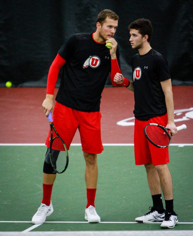Utahs Egbert Weverink and David Micevski talk strategy during a doubles match against Montana State at the Eccles Tennis Center February 5, 2017. Michael Adam Fondren for the Daily Utah Chronicle.