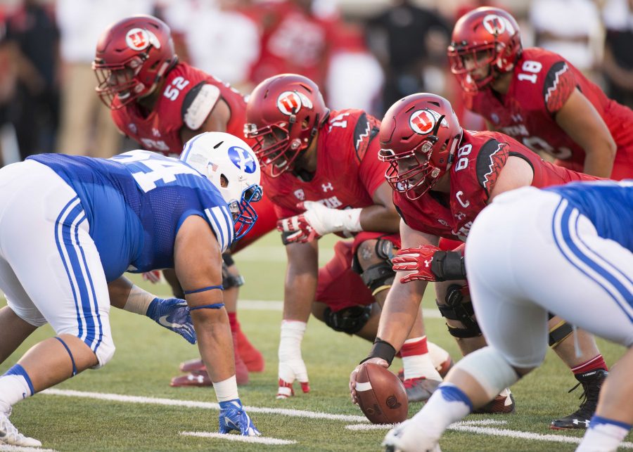 University of Utah Football junior offensive lineman J.J. Dielman (68) snaps the ball during the game vs. the Brigham Young University Cougars at Rice-Eccles Stadium on Saturday, September 10, 2016