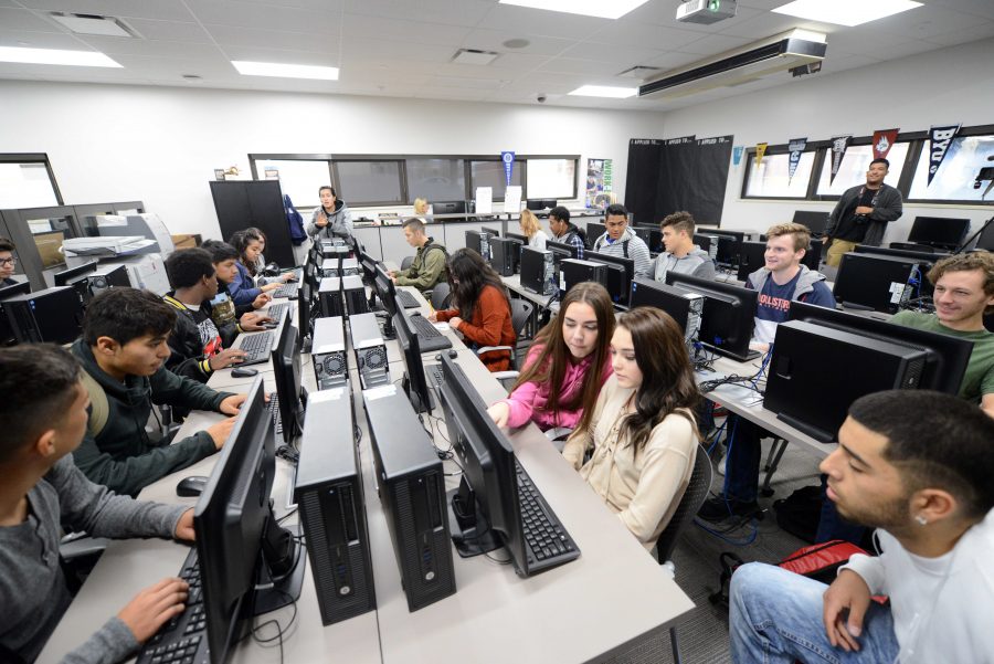 Utah high school students getting help with their college applications while in school. Courtesy of Genevieve Erickson.
