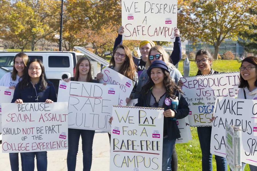 Students 4 Choice holding their signs during the sexual assault protest in the MEB parking lot on Friday, Nov 4, 2016