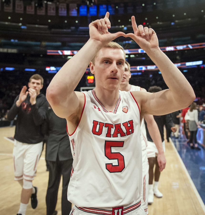 Utah Utes guard Parker Van Dyke (5) flashes the U while walking off the court after the University of Utah Running Utes defeated the Western Kentucky Hilltoppers in the semifinal round of the 2018 NIT in Madison Square Garden in New York City on