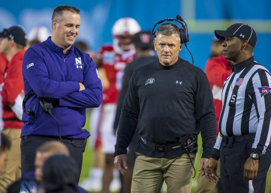 Northwestern University football head coach Pat Fitzgerald and University of Utah football head coach Kyle Whittingham together during an injury timeout during the San Diego County Credit Union Holiday Bowl at SDCCU Stadium in San Diego, California on Monday, Dec. 31, 2018. (Photo by Kiffer Creveling | The Daily Utah Chronicle)