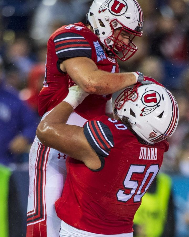 University of Utah sophomore offensive lineman Orlando Umana (50) celebrates with University of Utah junior tight end Jake Jackson (44) after scoring a touchdown during the San Diego County Credit Union Holiday Bowl vs. Northwestern University at SDCCU Stadium in San Diego, California on Monday, Dec. 31, 2018. (Photo by Kiffer Creveling | The Daily Utah Chronicle)