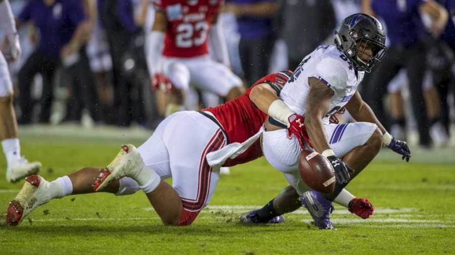 Northwestern University junior slotback Cameron Green (84) fumbles the ball from University of Utah defense during the San Diego County Credit Union Holiday Bowl at SDCCU Stadium in San Diego, California on Monday, Dec. 31, 2018. (Photo by Kiffer Creveling | The Daily Utah Chronicle)