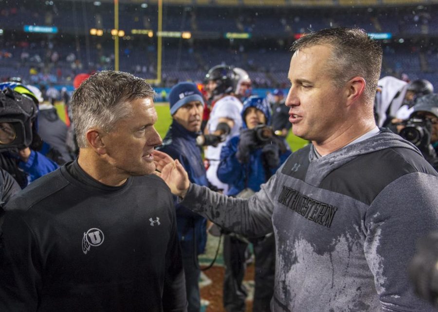 University of Utah football head coach Kyle Whittingham congratulates Northwestern University football head coach Pat Fitzgerald on their victory following the San Diego County Credit Union Holiday Bowl at SDCCU Stadium in San Diego, California on Monday, Dec. 31, 2018. (Photo by Kiffer Creveling | The Daily Utah Chronicle)