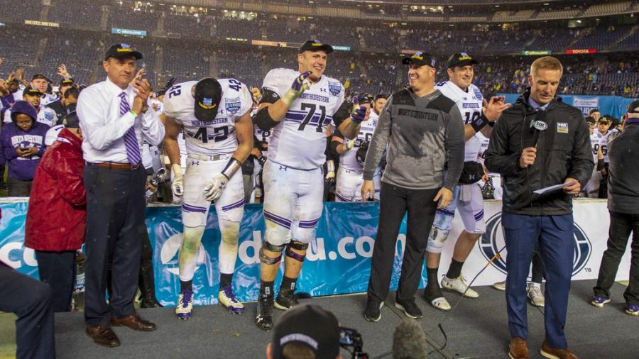 Northwestern University receives their trophy following their victory over The University of Utah during the San Diego County Credit Union Holiday Bowl at SDCCU Stadium in San Diego, California on Monday, Dec. 31, 2018. (Photo by Kiffer Creveling | The Daily Utah Chronicle)