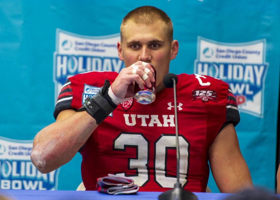 University of Utah senior linebacker Cody Barton (30) drinks a Dr. Pepper following a question at the post game interview following the San Diego County Credit Union Holiday Bowl vs. Northwestern University at SDCCU Stadium in San Diego, California on Monday, Dec. 31, 2018. (Photo by Kiffer Creveling | The Daily Utah Chronicle)