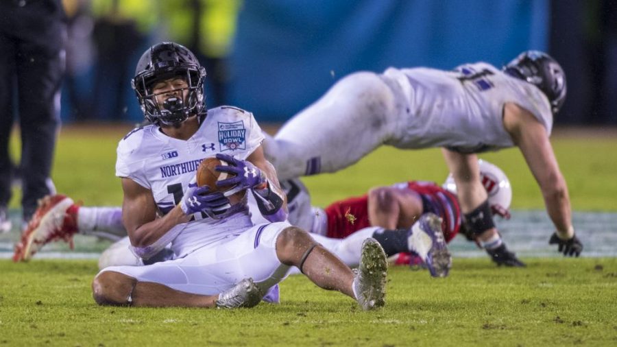 Northwestern University sophomore defensive back JR Pace (13) makes an interception during the San Diego County Credit Union Holiday Bowl vs. The University of Utah at SDCCU Stadium in San Diego, California on Monday, Dec. 31, 2018. (Photo by Kiffer Creveling | The Daily Utah Chronicle)
