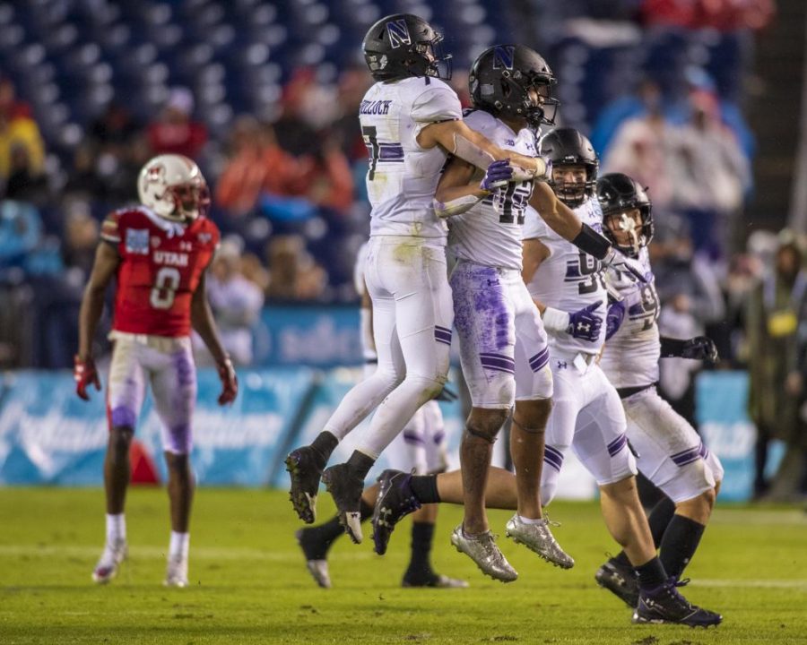 Northwestern University celebrates after JR Pace (13) made an interception during the San Diego County Credit Union Holiday Bowl vs. The University of Utah at SDCCU Stadium in San Diego, California on Monday, Dec. 31, 2018. (Photo by Kiffer Creveling | The Daily Utah Chronicle)