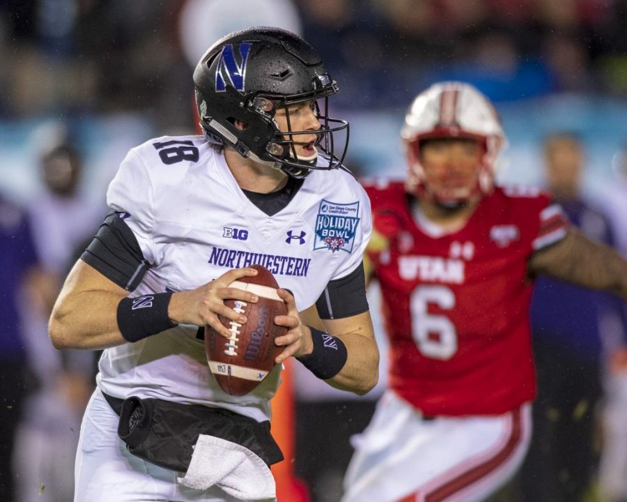 Northwestern University senior quarterback Clayton Thorson (18) looks for an open man during the San Diego County Credit Union Holiday Bowl vs. The University of Utah at SDCCU Stadium in San Diego, California on Monday, Dec. 31, 2018. (Photo by Kiffer Creveling | The Daily Utah Chronicle)