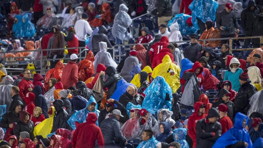 University of Utah fans leave the stadium during a rainstorm before the end of the game during the San Diego County Credit Union Holiday Bowl vs. Northwestern University at SDCCU Stadium in San Diego, California on Monday, Dec. 31, 2018. (Photo by Kiffer Creveling | The Daily Utah Chronicle)