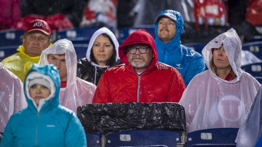 University of Utah fans watch the game during a rainstorm before the end of the game during the San Diego County Credit Union Holiday Bowl vs. Northwestern University at SDCCU Stadium in San Diego, California on Monday, Dec. 31, 2018. (Photo by Kiffer Creveling | The Daily Utah Chronicle)