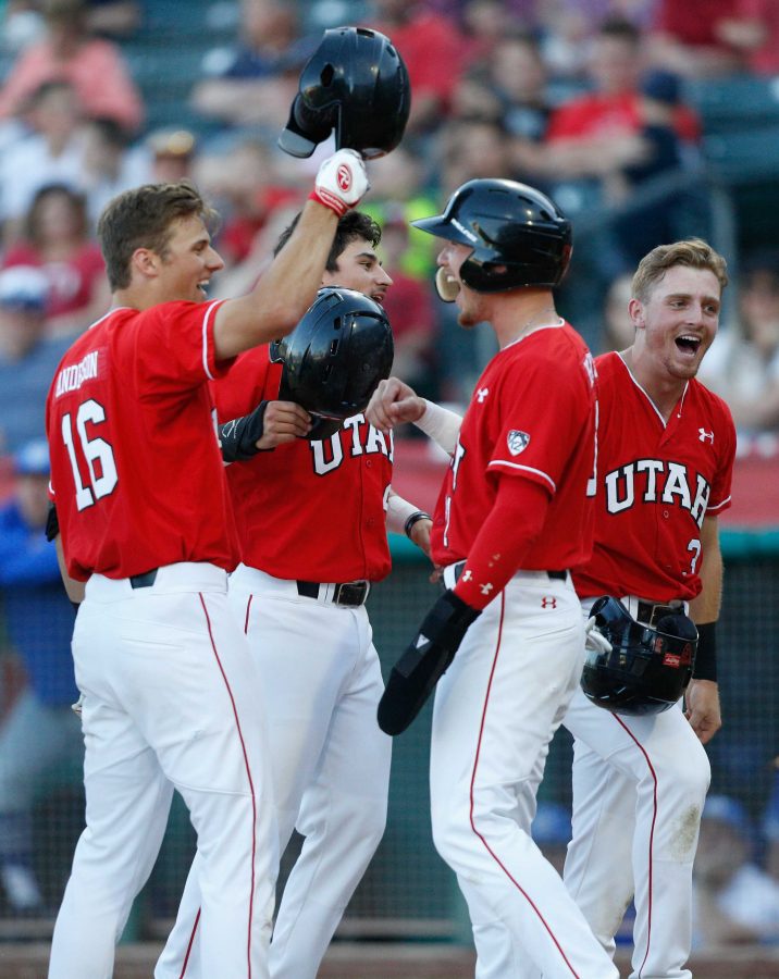 DeShawn Keirsey (9), Oliver Dunn (3) and Ryyker Tom (21) celebrate at home plate with Chandler Anderson (16) after Anderson hit a grand slam as theUtes take on the BYU Cougars at Smiths Ballpark May 8, 2018.

(Photo by: Justin Prather / Daily Utah Chronicle).