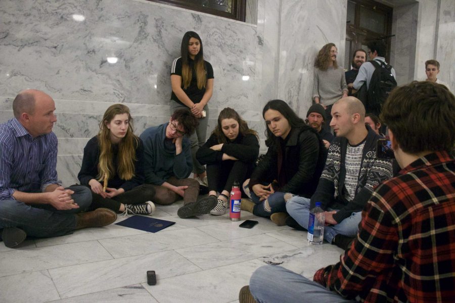 Lieutenant Gov. Spencer Cox sits with LGBTQ youth protesting conversion therapy outside of the governors offices at the Utah Capitol | Chronicle archives.