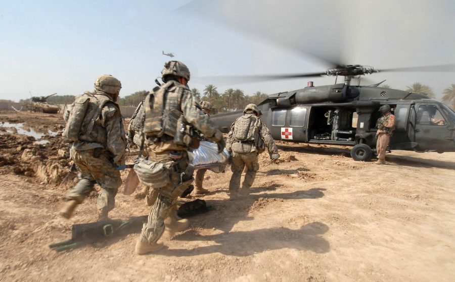 U.S. Army Soldiers transport a trauma victim to a U.S. Army medical helicopter in Tarmiyah, Iraq, Sept. 30, 2007. The Soldiers are working with local Iraqi hospital personnel in administering aid to trauma victims following an explosion caused by insurgents, which wounded several civilians. The Soldiers are  from Charlie Company, 4th Battalion, 9th Infantry Regiment, 4th Stryker Brigade Combat Team, 2nd Infantry Division out of Ft. Lewis, Wash. (U.S. Navy photo by Mass Communication Specialist 2nd Class Summer M. Anderson) (Released)
