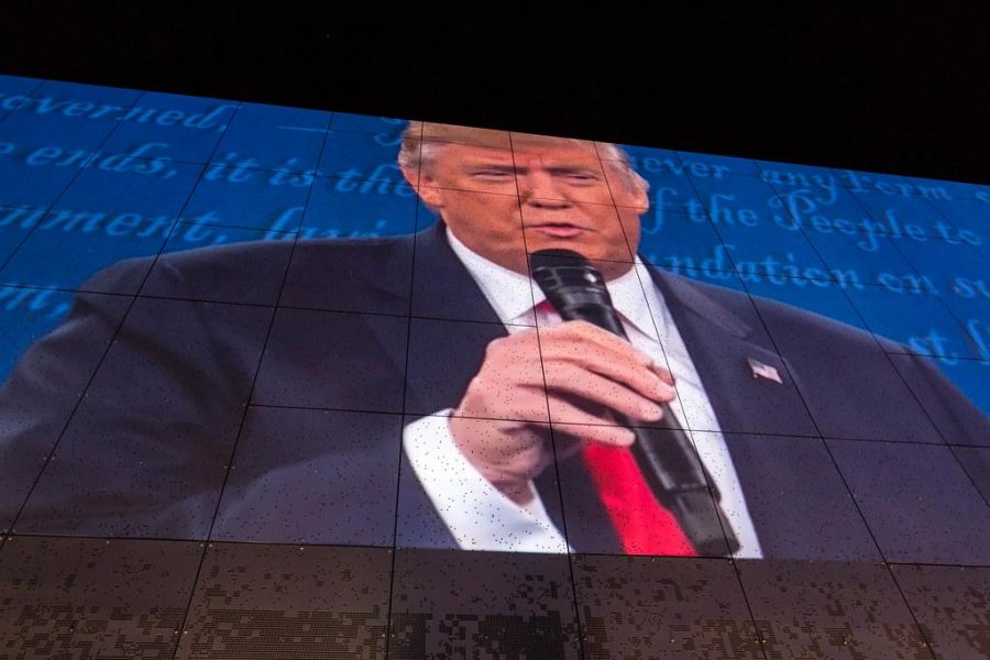 Donald Trumps image is projected on the side wall of Public Media Commons in St. Louis during the second presidential debate watch party. (Courtesy Flickr)