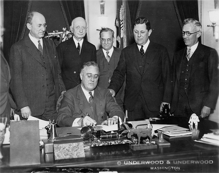 President Franklin D. Roosevelt signs the Gold Reserve Actt on Jan. 30, 1934. (Courtesy Wikimedia Commons)