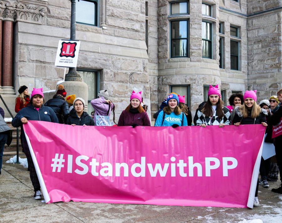 Demonstrators hold a Planned Parenthood sign at the Womxn’s March at Washington Square Park in Salt Lake City, Utah on Jan. 18, 2020. 