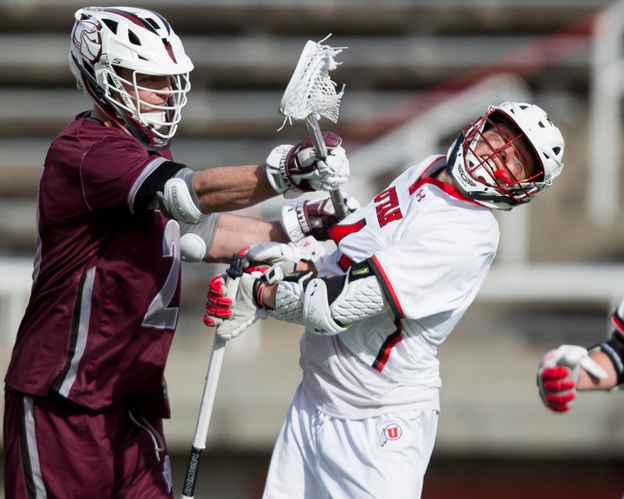 University of Utah player is fouled by an opponent during an NCAA Lacrosse game vs. Bellarmine University at the Rice Eccles Stadium in Salt Lake City on Friday, Feb. 1, 2020. (Photo by Abu Asib | The Daily Utah Chronicle)

