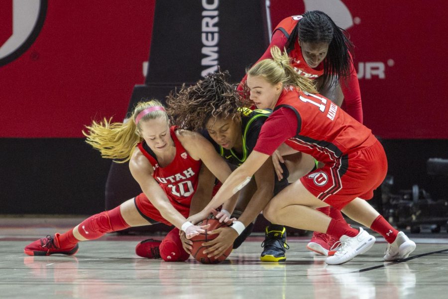 University of Utah players dive for a lose ball during an NCAA Basketball game vs. the University of Oregon at the Jon M. Huntsman Center in Salt Lake City, Utah on Thursday, Jan. 30, 2020. (Photo by Jalen Pace | The Daily Utah Chronicle)