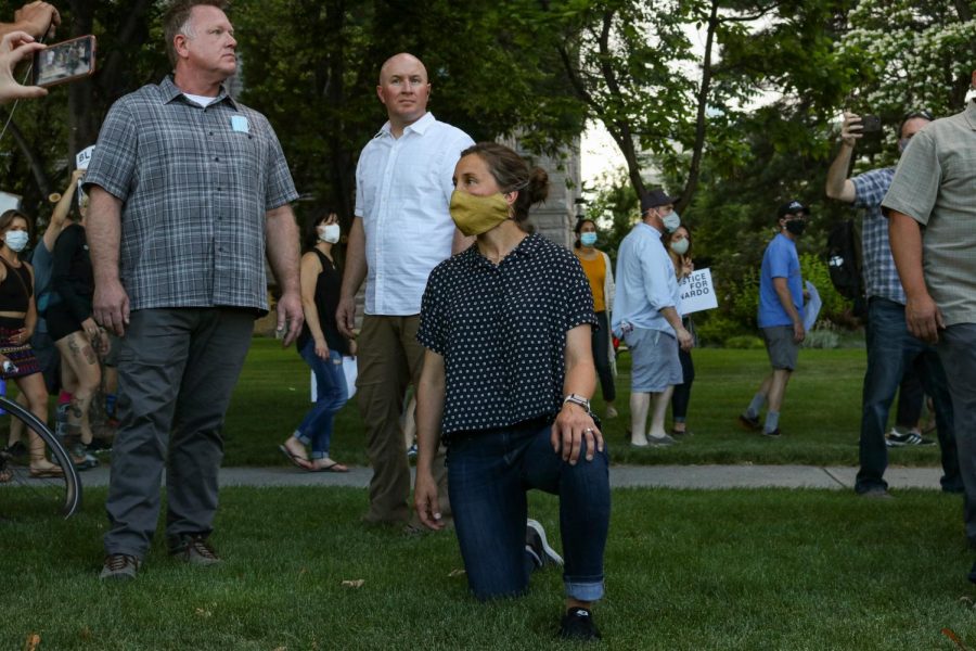 Mayor Erin Mendenhall takes a knee at Washington square park in Salt Lake City on June 4, 2020. I want to honor the movement that is happening in our city and across the nation. Its the least that I can do to show my support for the protesters, Mendenhall said.  (Photo by Ivana Martinez | The Daily Utah Chronicle)