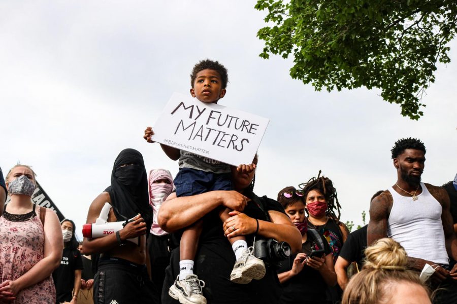 Julius Rowe Jr. and his mother Danielle Rowe at the Black Lives Matter Protest at the Utah Capitol in Salt Lake City on June 4, 2020. He wanted to come and show his support and show that he is a little Black boy and he wants to have a future, Danielle Rowe said. (Ivana Martinez I Daily Utah Chronicle)