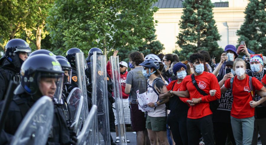 Salt Lake police officers in riot gear charge at protesters in the streets of Salt Lake City on July 9, 2020. (Photo by Ivana Martinez | Daily Utah Chronicle)