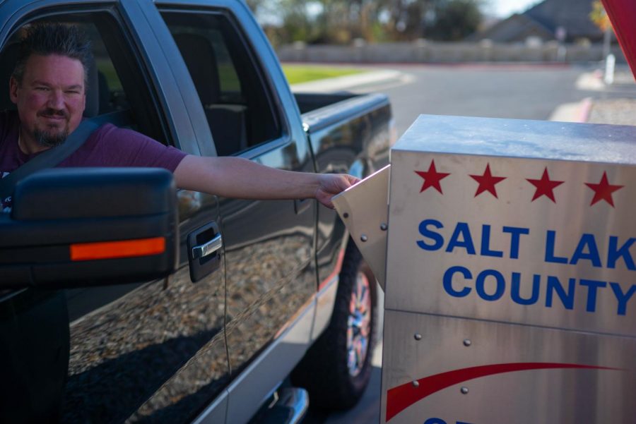 A voter drops off their ballot at Cottonwood Heights City Hall on October 31st, 2020. (Photo by Gwen Christopherson | The Daily Utah Chronicle)