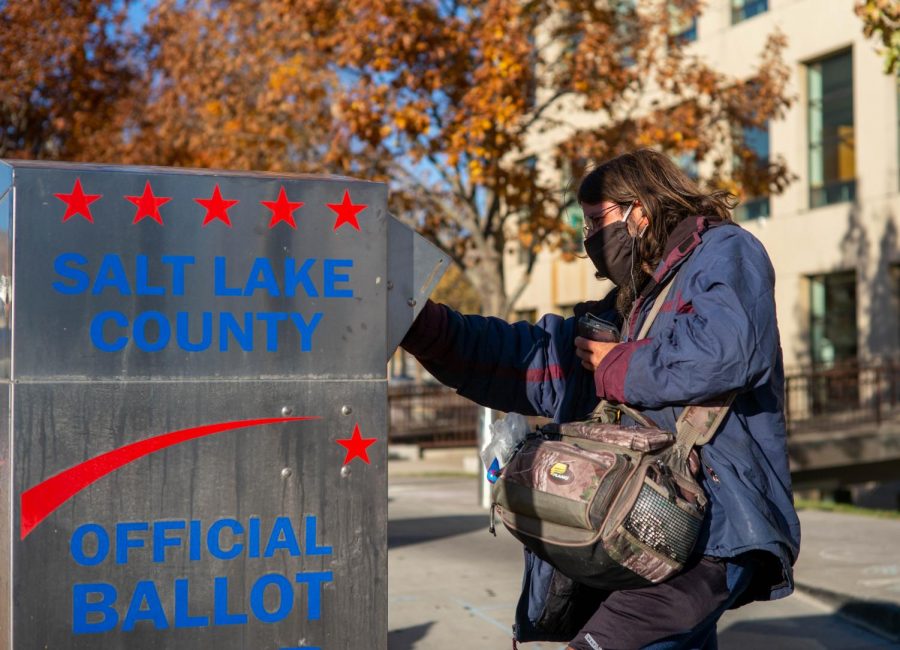 A voter drops off their ballot at Cottonwood Heights City Hall on October 31st, 2020. (Photo by Gwen Christopherson | The Daily Utah Chronicle)