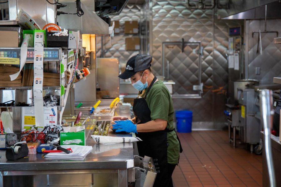 Silvia Ocampo prepares drive through orders at Del Taco on 800 E and 400 S in Salt Lake City on Nov. 14, 2020. (Photo by Gwen Christopherson | The Daily Utah Chronicle)