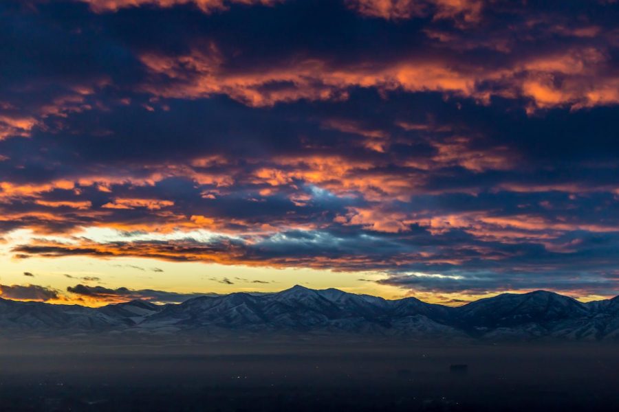 A colorful sunset over the infamous winter inversion on the Salt Lake Valley seen from Big Cottonwood Canyon Scenic Byway on Dec. 28, 2017 (Photo by Abu Asib | The Daily Utah Chronicle)