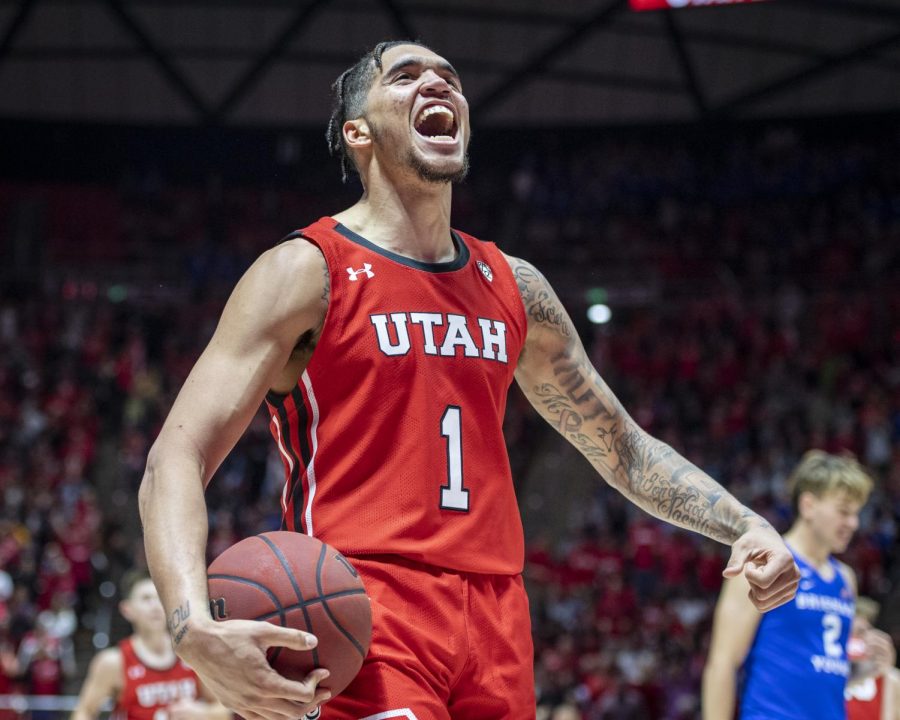 University of Utah sophomore forward Timmy Allen (1) celebrates after getting fouled by Brigham Young University senior Forward Dalton Nixon (33) during an NCAA Basketball game at the Jon M. Huntsman Center in Salt Lake City, Utah on Wednesday, Dec. 4, 2019. (Photo by Kiffer Creveling | The Daily Utah Chronicle)
