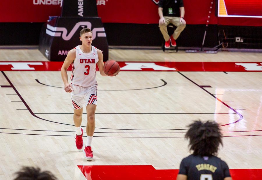 University of Utah Mens Basketball player, Pelle Larsson (#3), brings the ball down the court in the season-opening game against the University of Washington in the Jon M. Huntsman Center on Dec. 3, 2020. (Photo by Jack Gambassi | The Daily Utah Chronicle)