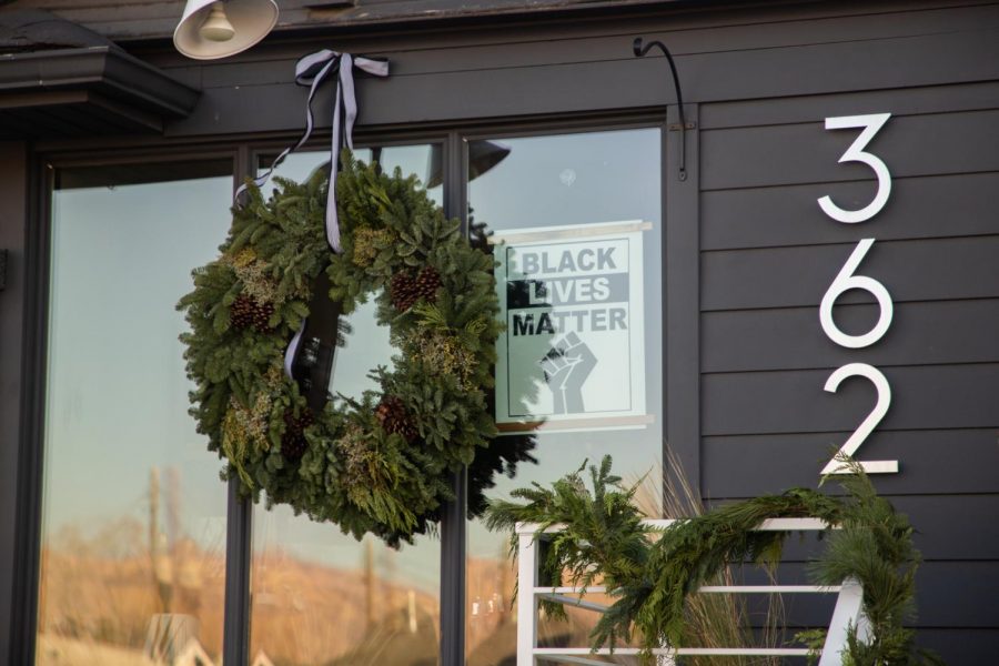 Store windows at Thyme and Place Friday morning, showing their support for the Black Lives Matter Movement. (Photo by Maya Fraser | The Daily Utah Chronicle)