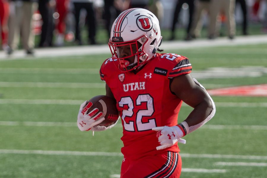 University of Utah Football freshman running-back Ty Jordan (#22) scores his first touchdown of the game in the Utes comeback win against Washington State University on Dec. 18, 2020 in Rice-Eccles Stadium in Salt Lake City. (Photo by Jack Gambassi | The Daily Utah Chronicle)