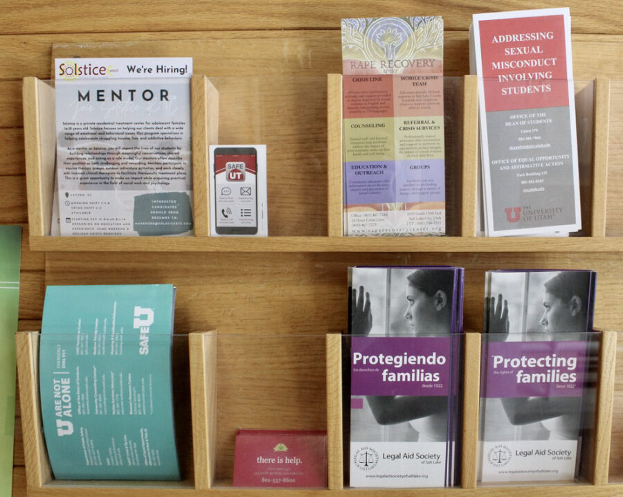 Inside the University of Utah Student Services Building a wall displays pamphlets with resources for sexual assault and mental health in Salt Lake City, on Tuesday, June 9, 2021.  (Photo by Brooklyn Critchley | The Daily Utah Chronicle)