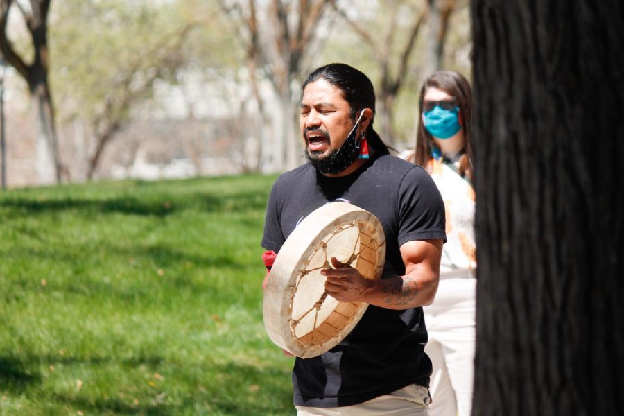 Carl Moore leads protesters in a land acknowledgment and prayer at a climate protest held by Divest U at the Union Plaza on April 22, 2021. (Photo by Natalie Colby | Daily Utah Chronicle)