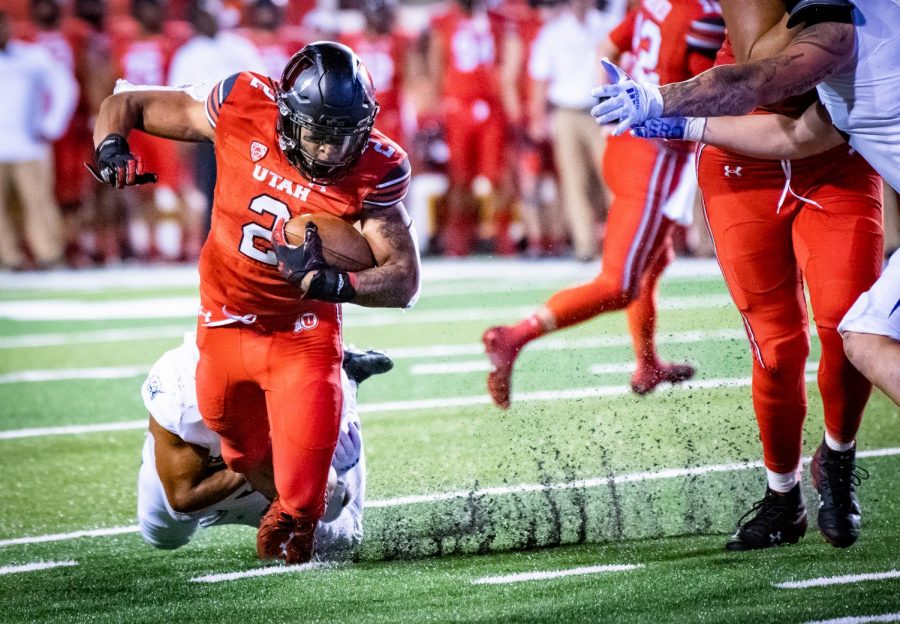 Utah running back Micah Bernard tries to escape from a tackle from Dixie State in Salt Lake City on September 2, 2021. (Photo by Jonathan Wang | The Daily Utah Chronicle)