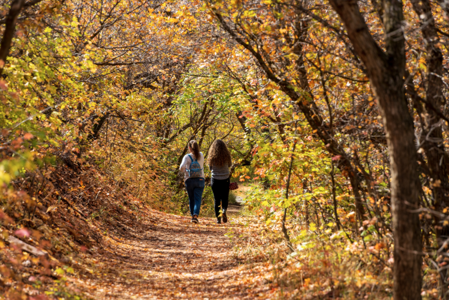 Two hikers on a trail by Red Butte Creek in Salt Lake City, Utah, on October 13th, 2021. (Photo by Xiangyao Axe Tang | The Daily Utah Chronicle)