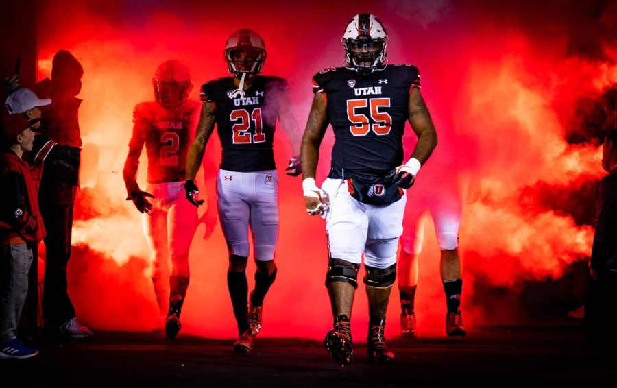 Junior center Nick Ford and junior wide receiver Solomon Enis walk out of the tunnel at the game against Arizona State football in Salt Lake City on Oct. 16, 2021. (Photo by Jonathan Wang | The Daily Utah Chronicle)
