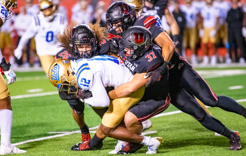 Three+Utah+linemen+tackling+UCLAs+Martell+Irby+in+Salt+Lake+City+on+Nov.+1%2C+2021.+%28Photo+by+Jonathan+Wang+%7C+The+Daily+Utah+Chronicle%29%0A