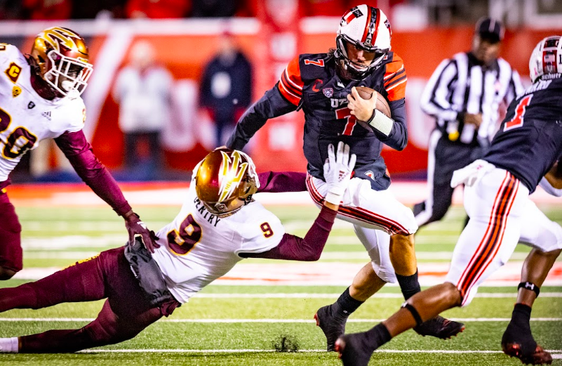 Sophomore quarterback Cam Rising attempts to break through the ASU defense at the game against Arizona State football in Salt Lake City on Oct. 16, 2021. (Photo by Jonathan Wang | The Daily Utah Chronicle)