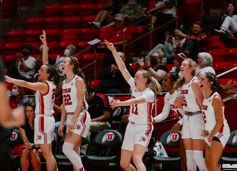 Celebration on the bench by the University of Utahs Womens basketball team as their teammate scored a three-pointer at the Huntsman Center in Salt Lake City, Nov. 10, 2021. (Photo by Rachel Rydalch | The Daily Utah Chronicle)