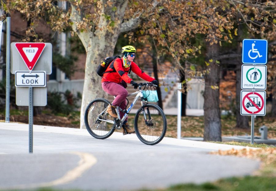 A+student+biker+biking+across+campus+at+the+University+of+Utah+in+Salt+Lake+City+on+Dec.+5%2C+2021.+%28Photo+by+Jonathan+Wang+%7C+The+Daily+Utah+Chronicle%29