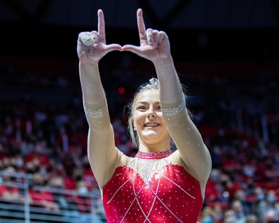 Lucy Stanhope flashing the U after a successful routine. (Photo by Jonathan Wang | The Daily Utah Chronicle)