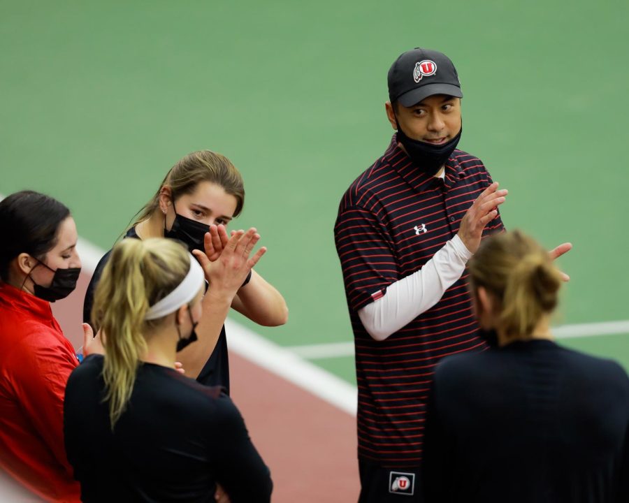 The Utah womens tennis head coach Ric Mortera congratulates the players for winning against New Mexico State University in an NCAA dual meet at the Jon M. Huntsman Tennis Center on Feb. 4, 2021. (Photo by Abu Asib | The Daily Utah Chronicle)

