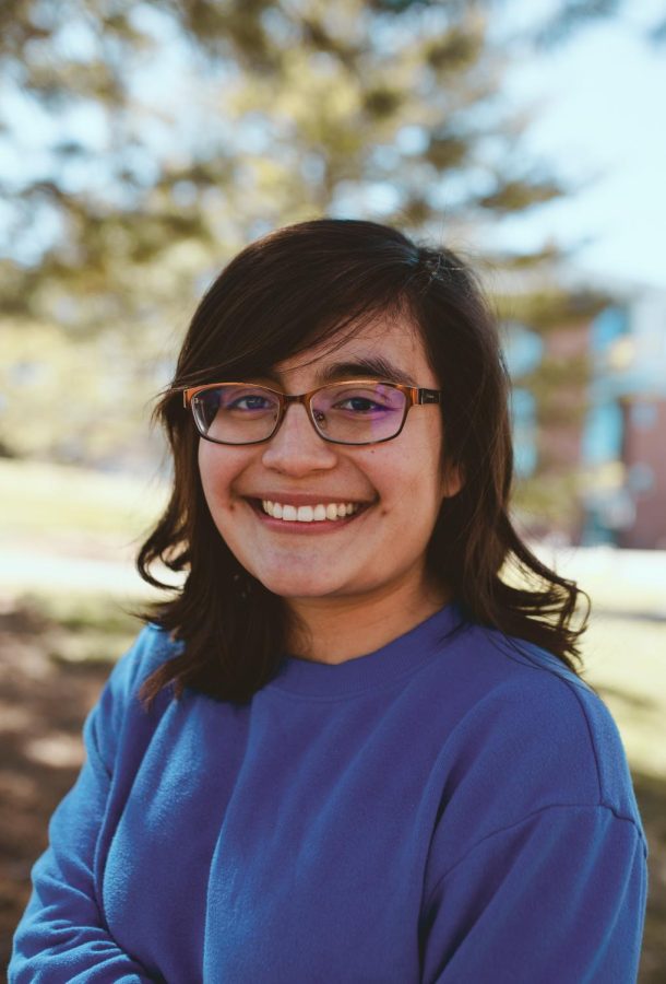 I work in and did my major in LNCO. Portrait of Sasha Poma by the Language and Communication building at the University of Utah, Salt Lake City on March 23, 2022. (Photo by Emily Rincon | The Daily Utah Chronicle)