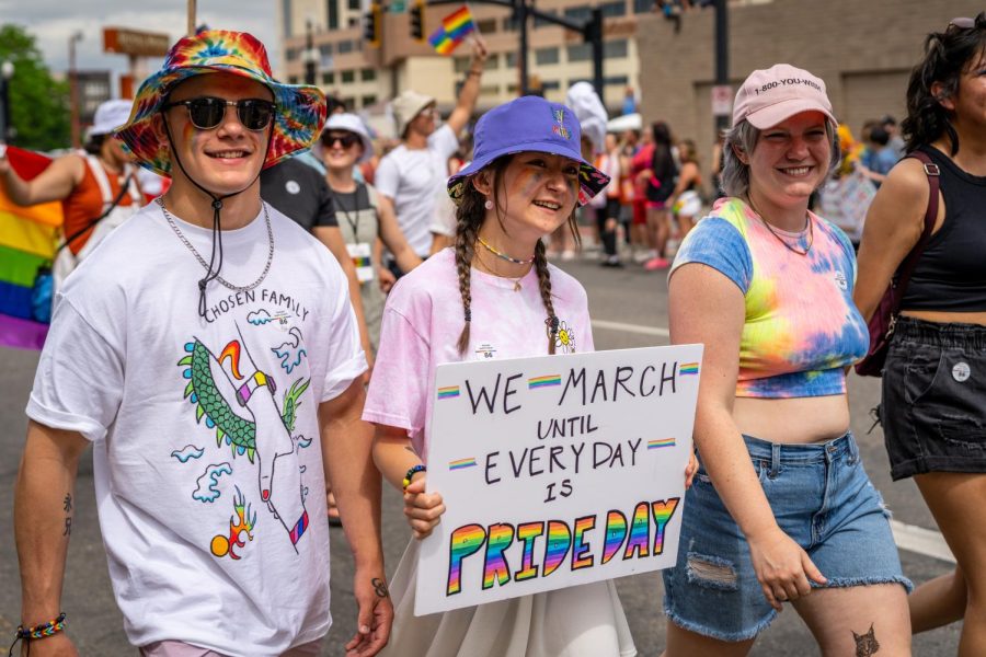 Participants from the Cougar Pride Center walk down the road at the Pride Parade in Salt Lake City, Utah, on Sunday, June 5, 2022. (Photo by Xiangyao Axe Tang | The Daily Utah Chronicle)