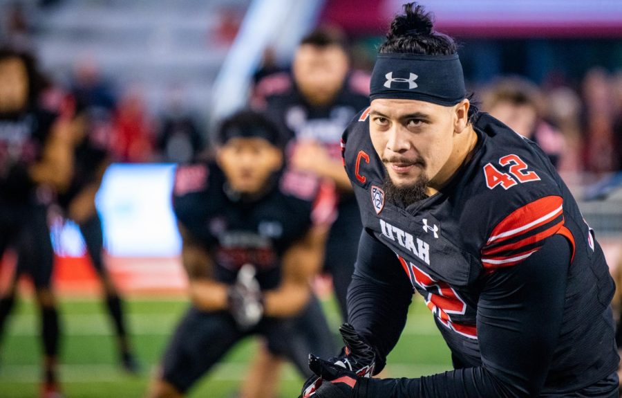 Junior captain Mika Tafua hypes the team during warmup against UCLA at the Rice-Eccles Stadium in Salt Lake City, Utah on Oct. 16, 2021. (Photo by Jonathan Wang | The Daily Utah Chronicle)